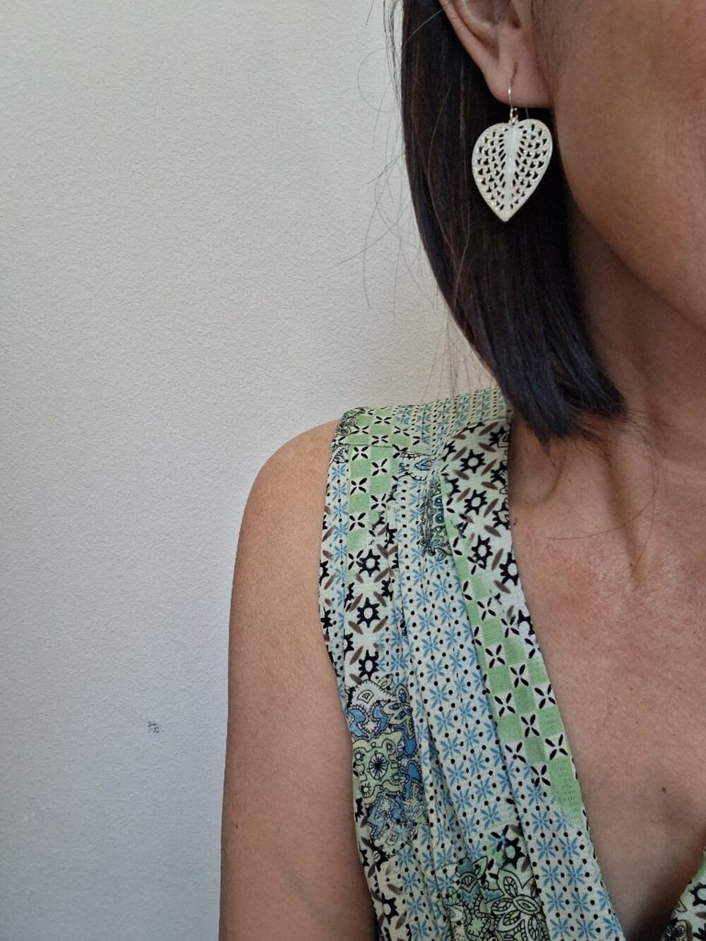 Delicate silver heart shaped dangle earrings